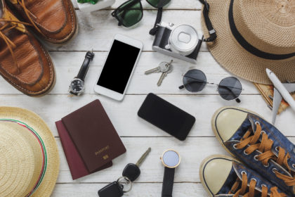 Top view women and man accessoires to travel concept.White and b